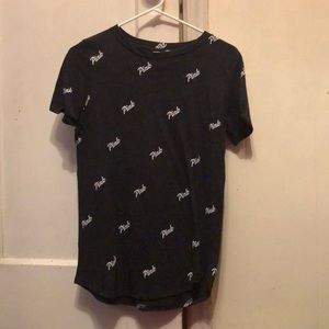 Short sleeve pink brand shirt.